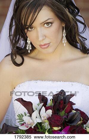 Bride in wedding dress with bouquet View Large Photo Image Stock Photography - Bride in wedding dress with bouquet. Fotosearch