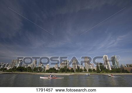 Cityscape across from boaters on a bay View Large Photo Image Stock Photo - Cityscape across from boaters on a bay. Fotosearch