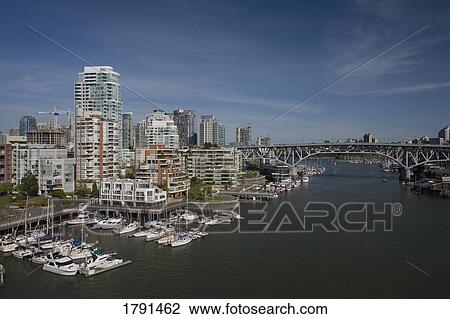 Stock Image - Cityscape, bridge and harbour. Fotosearch