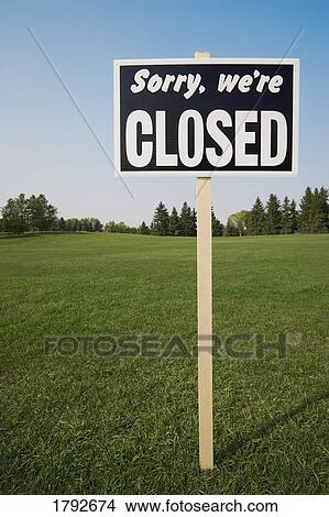 Closed sign in open field View Large Photo Image Picture - Closed sign in open field. Fotosearch