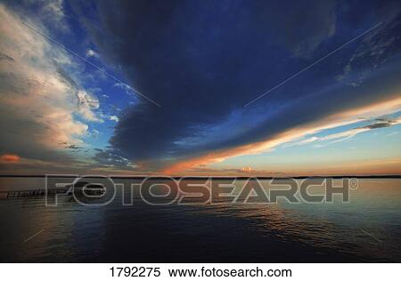 Stock Photography - Clouds over the water. Fotosearch