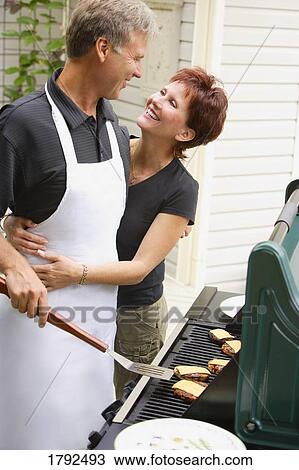 Couple at a bbq View Large Photo Image Stock Image - Couple at a bbq. Fotosearch