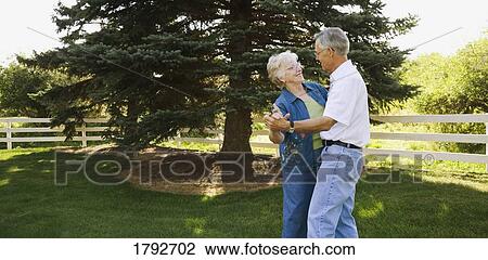 Elderly couple dancing outside View Large Photo Image Stock Image - Elderly couple dancing outside. Fotosearch