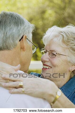 Elderly couple embracing View Large Photo Image Stock Image - Elderly couple embracing. Fotosearch