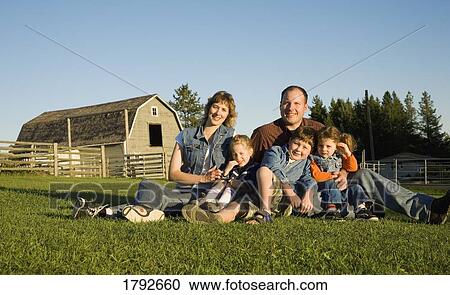 Stock Image - Family portrait on the farm. Fotosearch