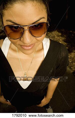 Female wearing sunglasses View Large Photo Image Stock Image - Female wearing sunglasses. Fotosearch