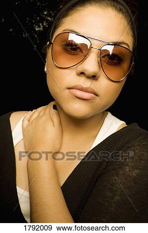 Female wearing sunglasses View Large Photo Image Stock Photo - Female wearing sunglasses. Fotosearch