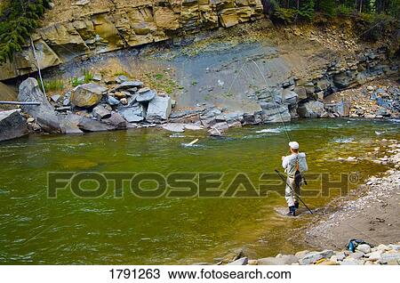 Fly fishing in a river View Large Photo Image Stock Image - Fly fishing in a river. Fotosearch