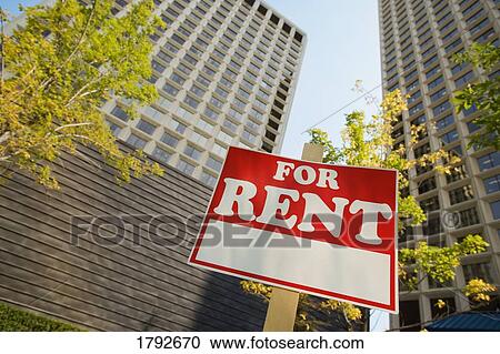 For rent sign in front of apartment buildings View Large Photo Image Stock Image - For rent sign in front of apartment buildings. Fotosearch