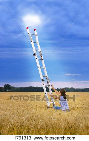 Stock Image - Girl climbing ladder to heaven . Fotosearch