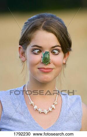 Girl with frog on nose View Large Photo Image Stock Image - Girl with frog on nose. Fotosearch