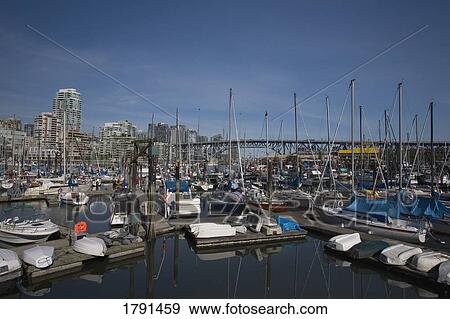 Harbour with cityscape in background View Large Photo Image Stock Photo - Harbour with cityscape in background. Fotosearch