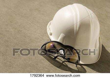 Hard hat and safety glasses View Large Photo Image Picture - Hard hat and safety glasses. Fotosearch