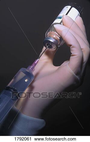 Health professional filling syringe View Large Photo Image Stock Image - Health professional filling syringe. Fotosearch