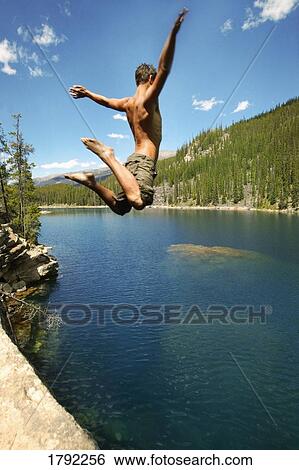 Stock Photograph - High jump into lake. Fotosearch