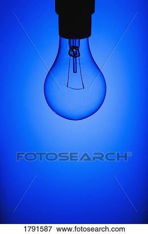 Light bulb on blue background View Large Photo Image Stock Photo - Light bulb on blue background. Fotosearch