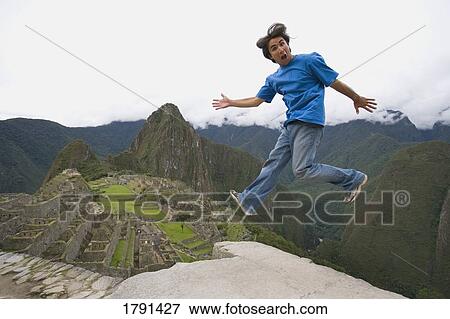 Man at the Inca ruins of Machu Picchu in Peru View Large Photo Image Stock Photo - Man at the Inca ruins of Machu Picchu in Peru. Fotosearch