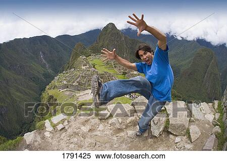 Man at the Inca ruins of Machu Picchu in Peru View Large Photo Image Stock Photography - Man at the Inca ruins of Machu Picchu in Peru. Fotosearch