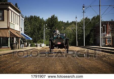Man driving vintage car View Large Photo Image Stock Photo - Man driving vintage car. Fotosearch