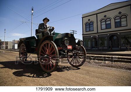 Man driving vintage car View Large Photo Image Stock Photo - Man driving vintage car. Fotosearch