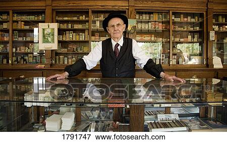 Man in an old fashioned pharmacy View Large Photo Image Stock Photo - Man in an old fashioned pharmacy. Fotosearch