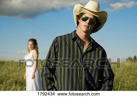 Picture - Man wearing cowboy hat . Fotosearch