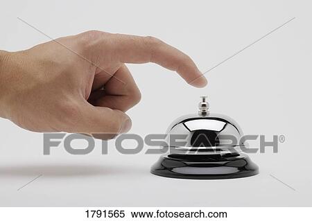 Man's hand about to ring a bell View Large Photo Image Stock Photography - Man's hand about to ring a bell. Fotosearch