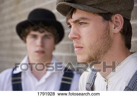 Stock Photo - Men in old-fashioned clothes . Fotosearch