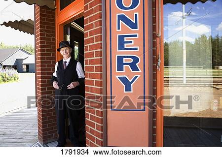 Older man outside business View Large Photo Image Picture - Older man outside business. Fotosearch