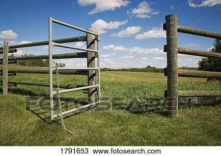 Stock Image - Open gate on farm. Fotosearch