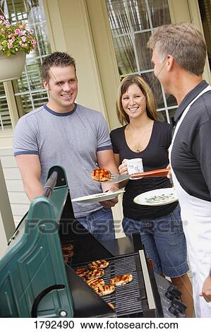 People at a BBQ View Large Photo Image Stock Image - People at a BBQ. Fotosearch