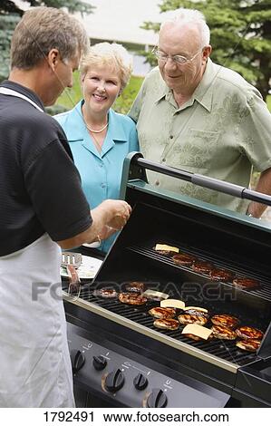 People at a BBQ View Large Photo Image Stock Image - People at a BBQ. Fotosearch