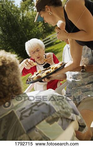 Stock Photography - People having dessert. Fotosearch