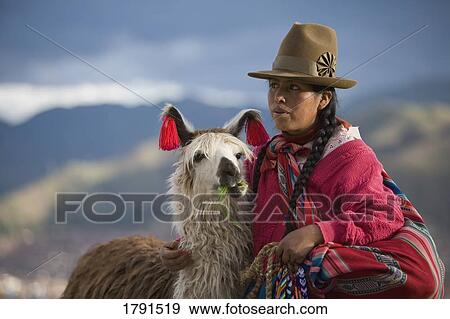 Peruvian woman with an Alpaca View Large Photo Image Stock Photo - Peruvian woman with an Alpaca. Fotosearch