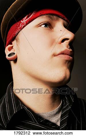Portrait of young man with piercings View Large Photo Image Stock Image - Portrait of young man with piercings. Fotosearch