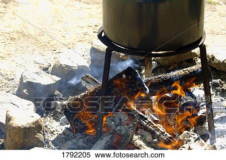 Stock Photography - Pot over open flame. Fotosearch