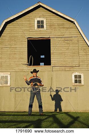 Rancher with a lasso View Large Photo Image Stock Image - Rancher with a lasso. Fotosearch
