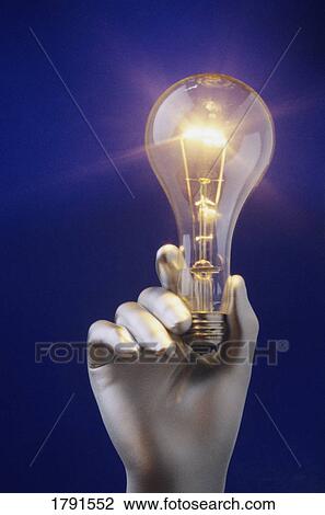 Silver hand holding light bulb View Large Photo Image Stock Image - Silver hand holding light bulb. Fotosearch