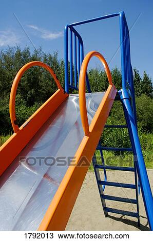 Slide at a park View Large Photo Image Stock Image - Slide at a park. Fotosearch