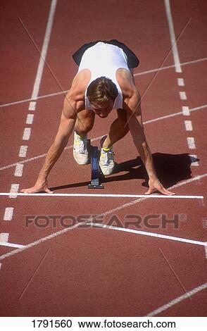 Sprinter on starting blocks View Large Photo Image Stock Image - Sprinter on starting blocks. Fotosearch
