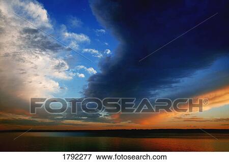 Sunset over water View Large Photo Image Stock Photo - Sunset over water. Fotosearch