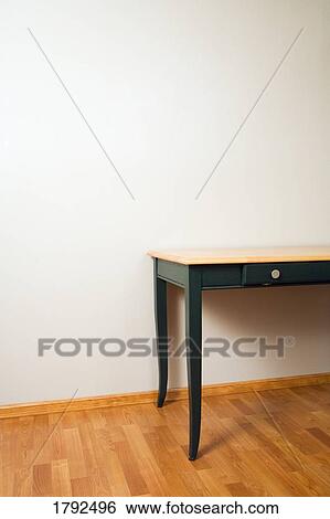 Table on hardwood floor View Large Photo Image Stock Photograph - Table on hardwood floor. Fotosearch