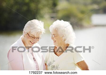 Two older women laughing View Large Photo Image Stock Photo - Two older women laughing. Fotosearch