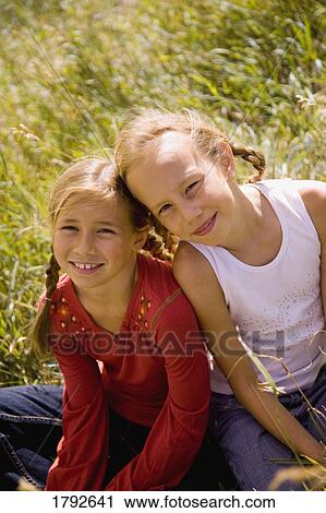 Two young girls View Large Photo Image Stock Image - Two young girls. Fotosearch