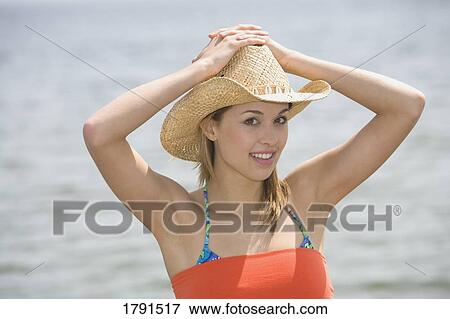 Stock Photo - Woman at the beach. Fotosearch