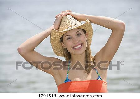 Stock Photo - Woman at the beach. Fotosearch