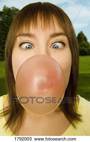 Woman blowing bubblegum View Large Photo Image Stock Image - Woman blowing bubblegum. Fotosearch