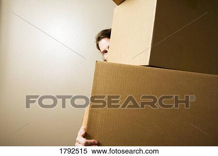 Woman carrying heavy boxes View Large Photo Image Stock Photography - Woman carrying heavy boxes. Fotosearch