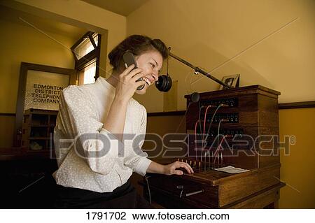 Woman dressed in historical costume on cell phone View Large Photo Image Stock Image - Woman dressed in historical costume on cell phone. Fotosearch