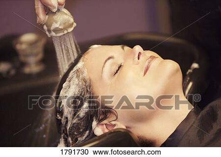 Woman having her hair washed View Large Photo Image Stock Image - Woman having her hair washed. Fotosearch